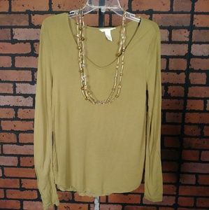 Green colored V neck blouse